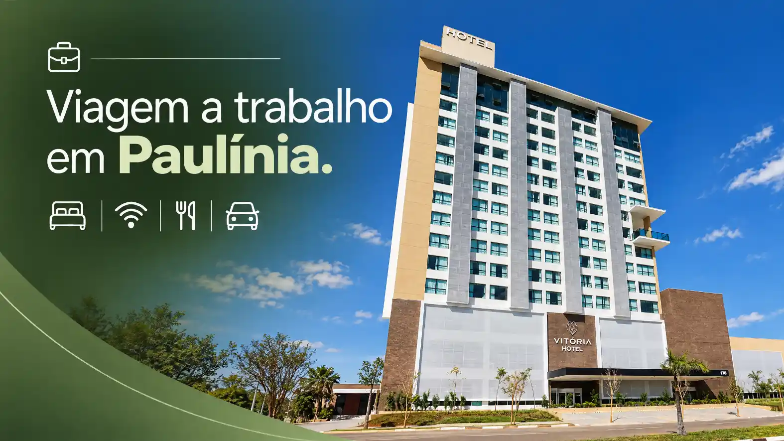 Hotel Vitória em Paulínia: fachada de prédio com placas de hotel no topo, janelas alinhadas e céu azul ao fundo em anúncio de viagem a trabalho.
